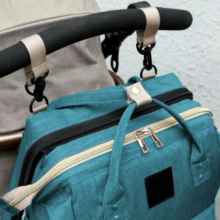 Multifunktionell skötväska med säng | Vattentät, USB-laddningsport & dagbädd – ComfiGo från Nuvella Baby More For Mini