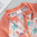 SunnySplash Zwemset Kinderen | T-Shirt, Broek & Zonnehoed | UV-Bescherming | Dinosaurus & Krab | 0-3 Jaar More For Mini